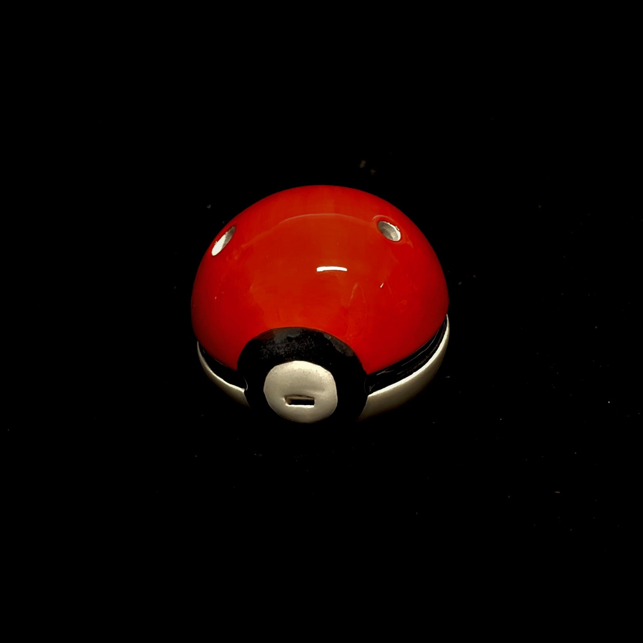 red, black and white pikaball pokeball 6-hole ocarina on a black background