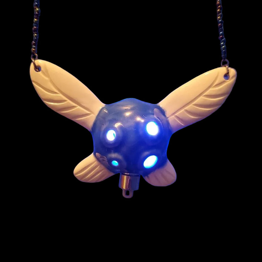 main picture of the blue and white  light-up fairy ocarina in the shape of Navi from Zelda : ocarina of time