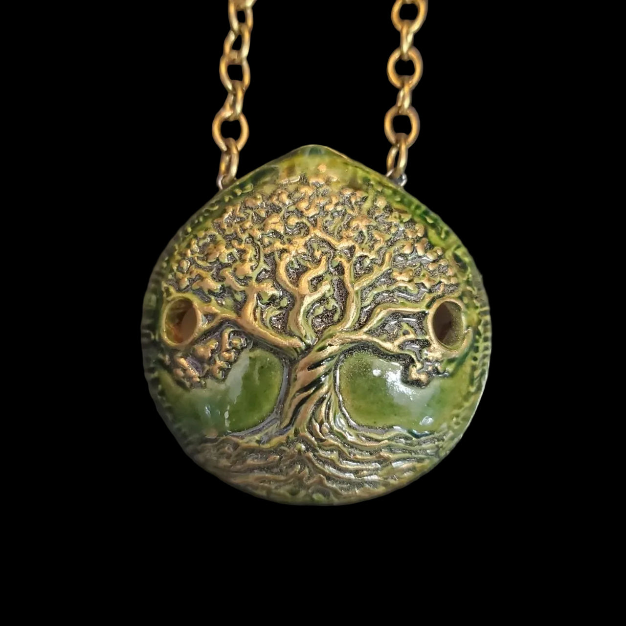 Necklace with a green and gold tree of life pendant ocarina