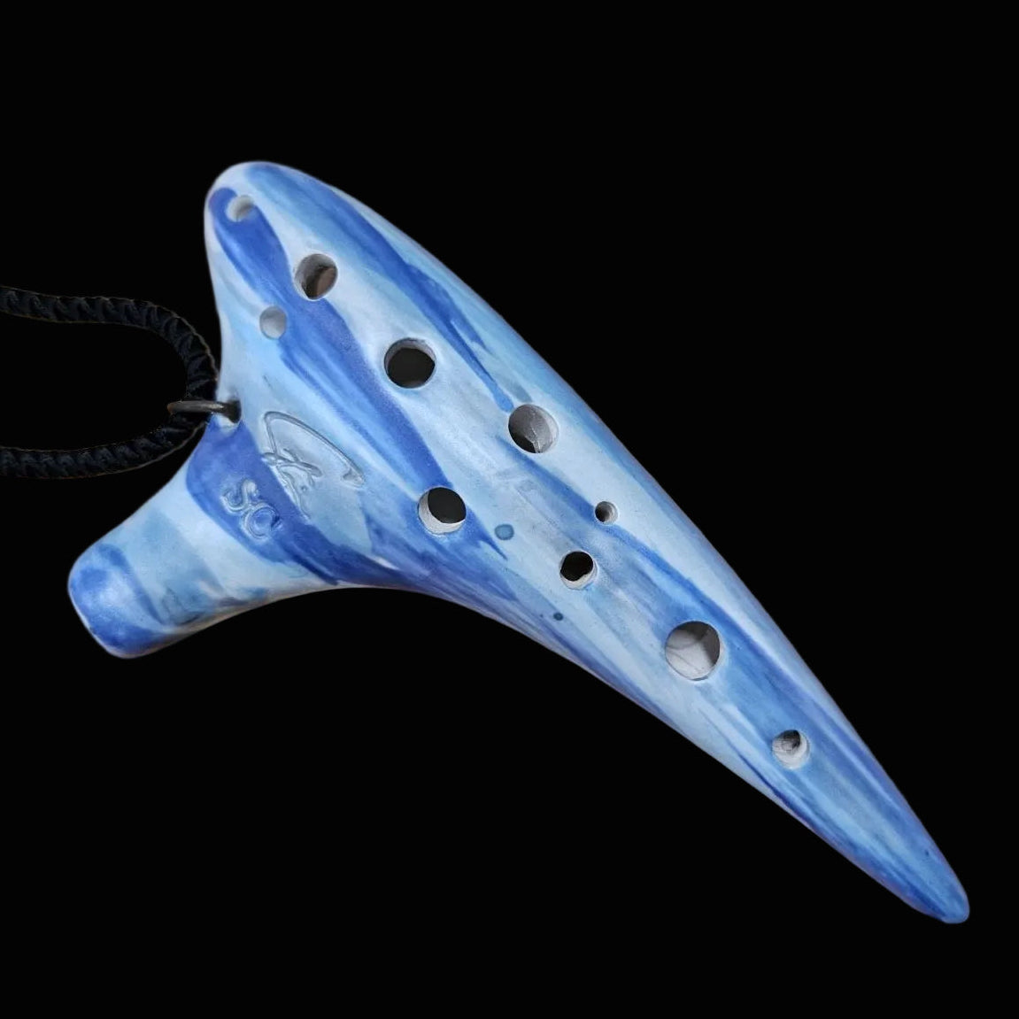 A handmade ceramic ocarina with blue and white marbled patterns, featuring a black cord
