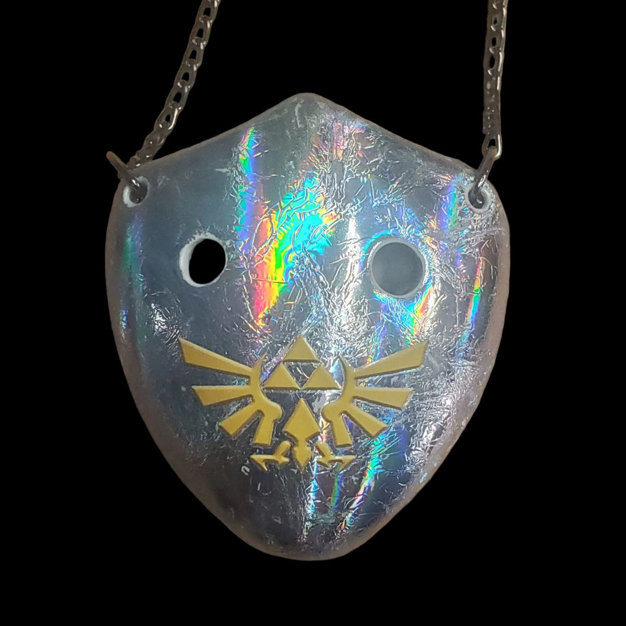 silver shield 6-hole clay ocarina featuring a royal family crest from Zelda